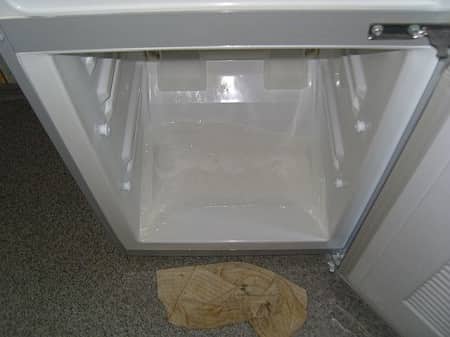 Puddles at the bottom of the refrigerator compartment